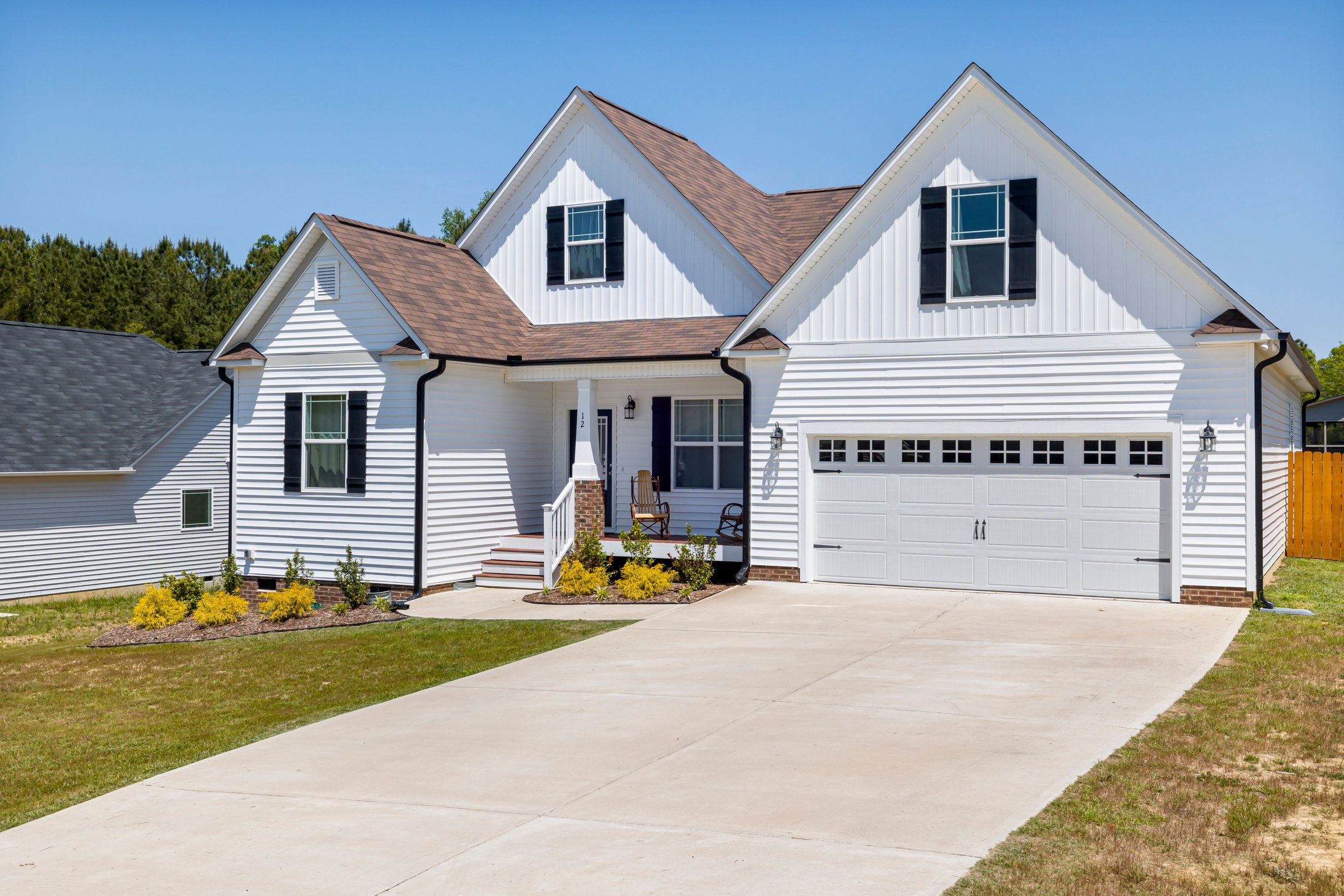 White and Gray Wooden House Under Blue Sky